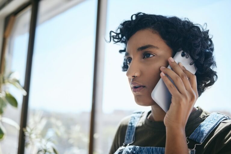 Business, phone call and woman from India in the office with a serious face. Businesswoman on smart